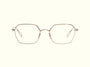 Montatura da vista Ahlem Richelieu Grey Gold su fondo beige